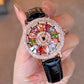 Reloj de Mujer con Esfera Giratoria y Diamantes Simulados de Colores