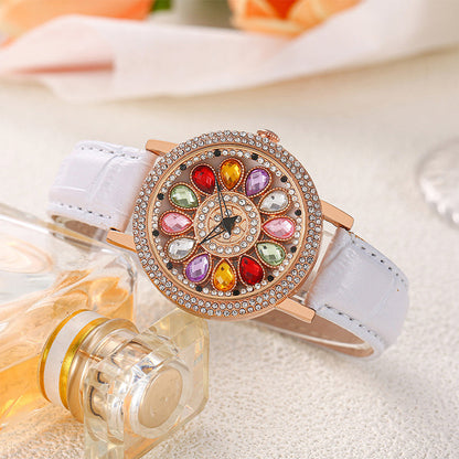 Reloj de Mujer con Esfera Giratoria y Diamantes Simulados de Colores