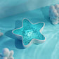 Proyector de luz con forma de estrella de mar y olas del océano